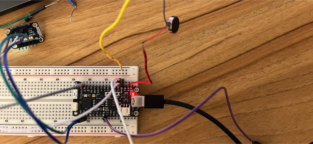 Breadboard prototype with MPU6050 and vibration motor wired to microcontroller